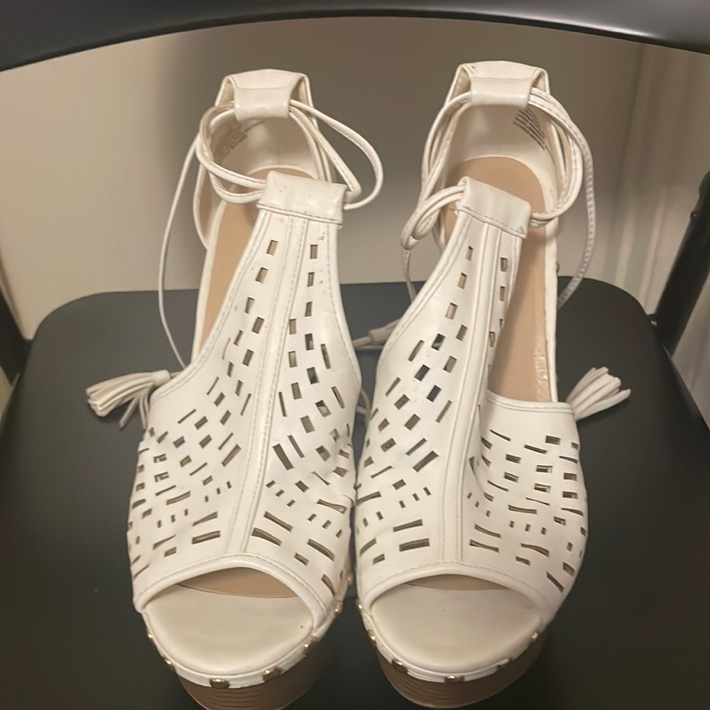 White wedge Sandals. Wedge is pretty tall, lace up shoes